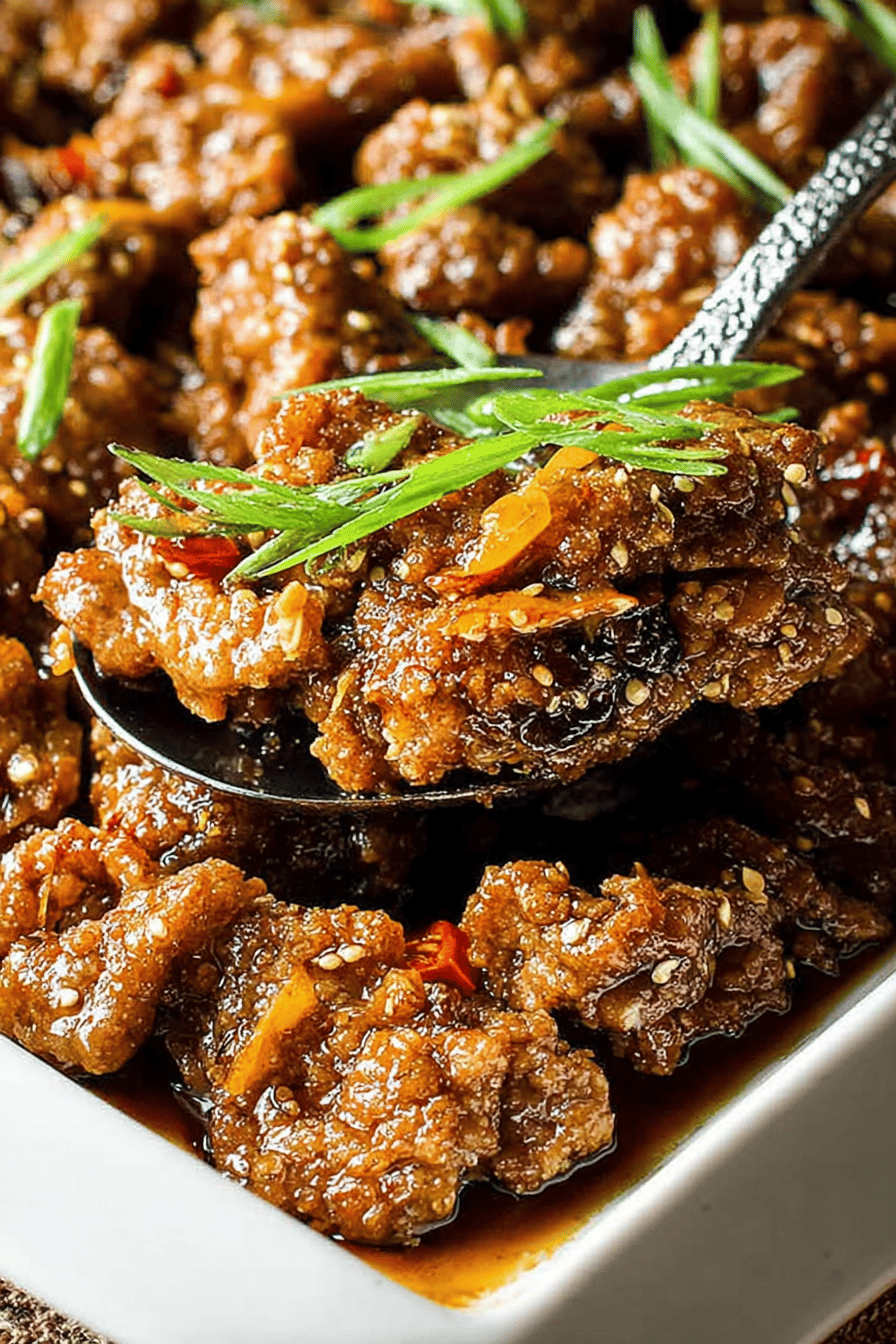 Easy Crispy Orange Beef Recipe slice on plate showing perfect texture and swirl pattern