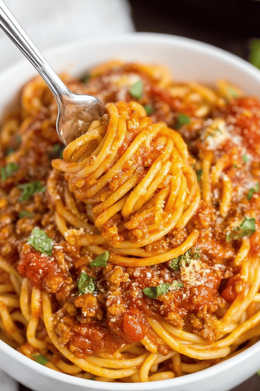 Easy Instant Pot Spaghetti Recipe slice on plate showing perfect texture and swirl pattern